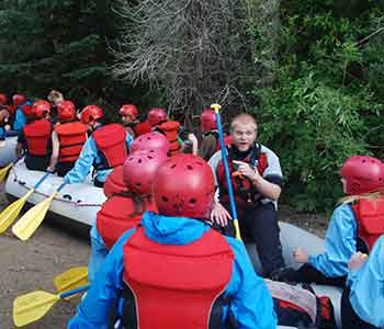 Raft guide safety talk with guests